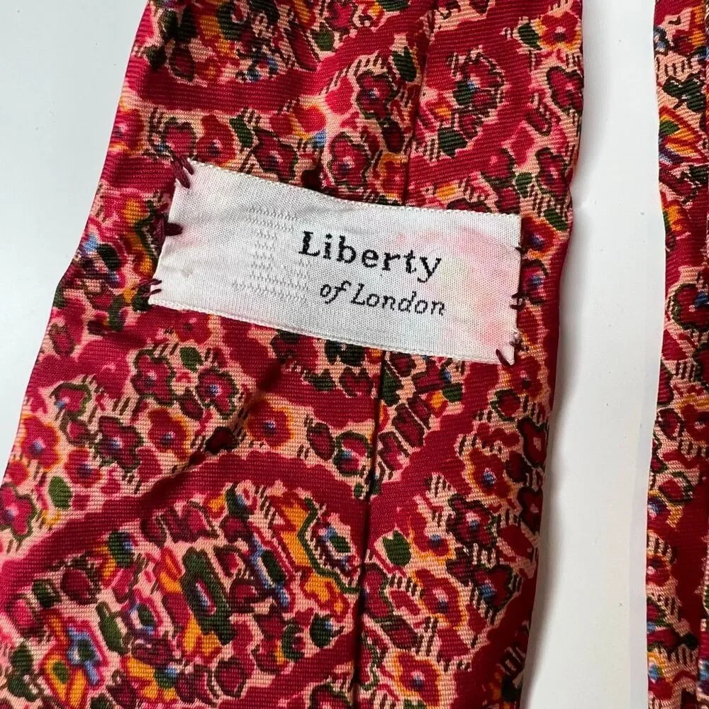 Liberty of London vintage red patterned silk necktie features a vibrant tie